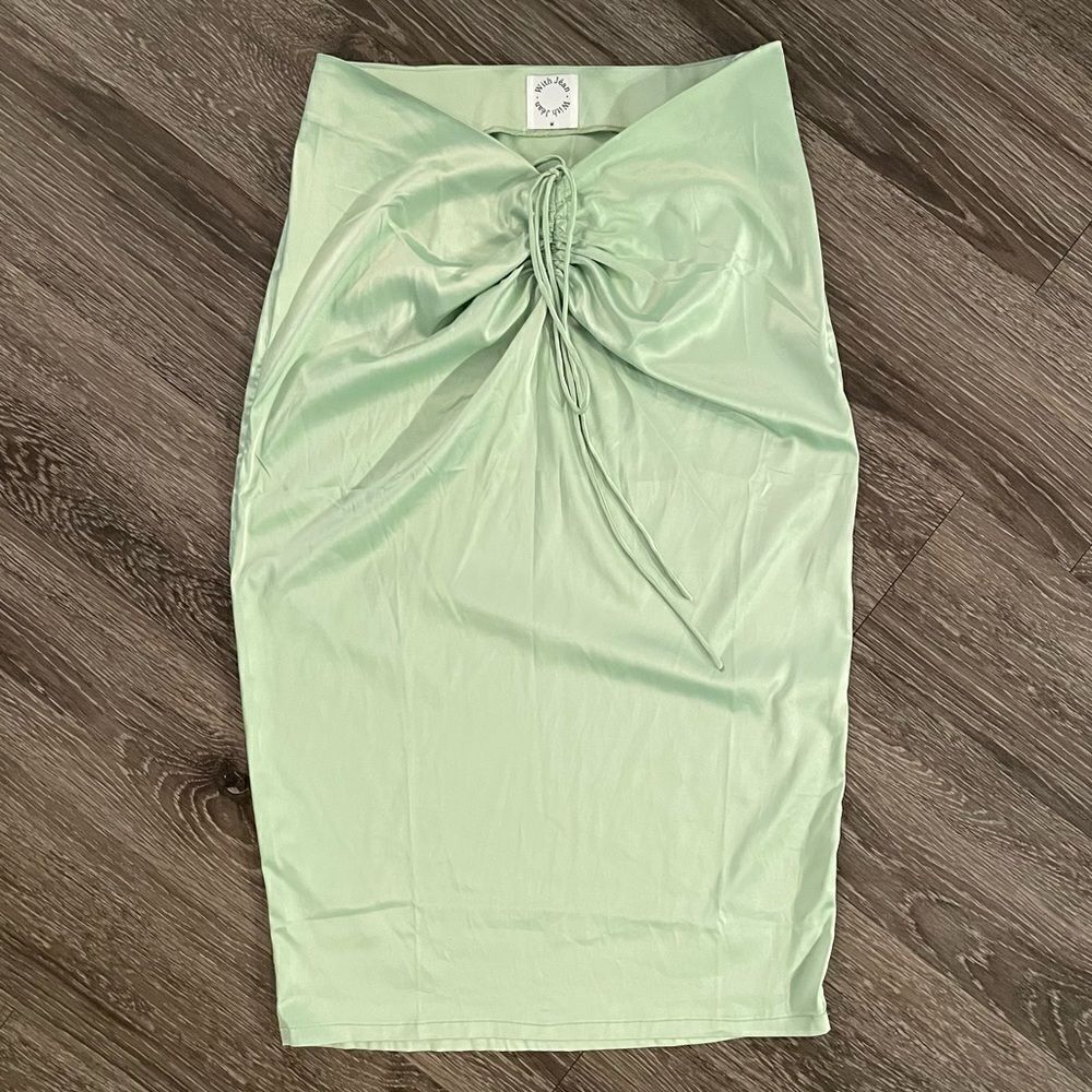 With jean lime green skirt